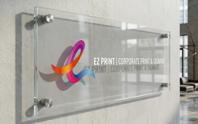 Polished clear acrylic signs with chrome standoff wall mounts, with the EZ Print logo.